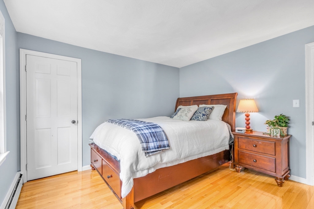 3 Erin Lane Norfolk, MA 02056 - Photo 24 of 37 a bedroom with a bed and a dresser