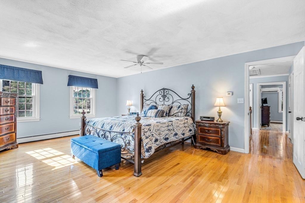 3 Erin Lane Norfolk, MA 02056 - Photo 27 of 37 a bedroom with furniture and wooden floor