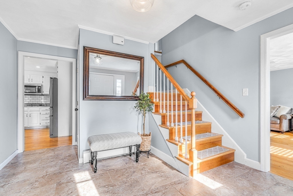 3 Erin Lane Norfolk, MA 02056 - Photo 5 of 37 a view of staircase with white walls and a next to a window