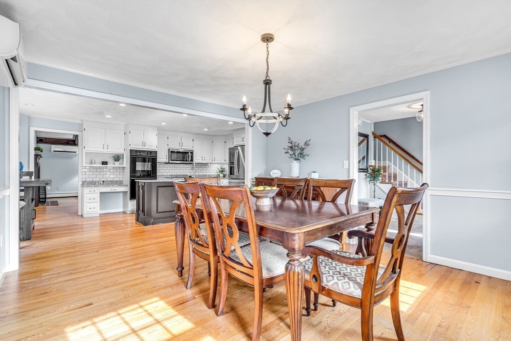 3 Erin Lane Norfolk, MA 02056 - Photo 6 of 37 a dining room with furniture and wooden floor