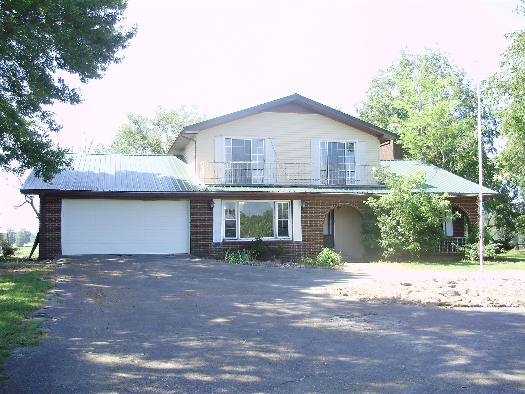 51 Ramah Road Leoma, TN 38468 - Photo 1 of 30 a front view of a house with a yard and garage