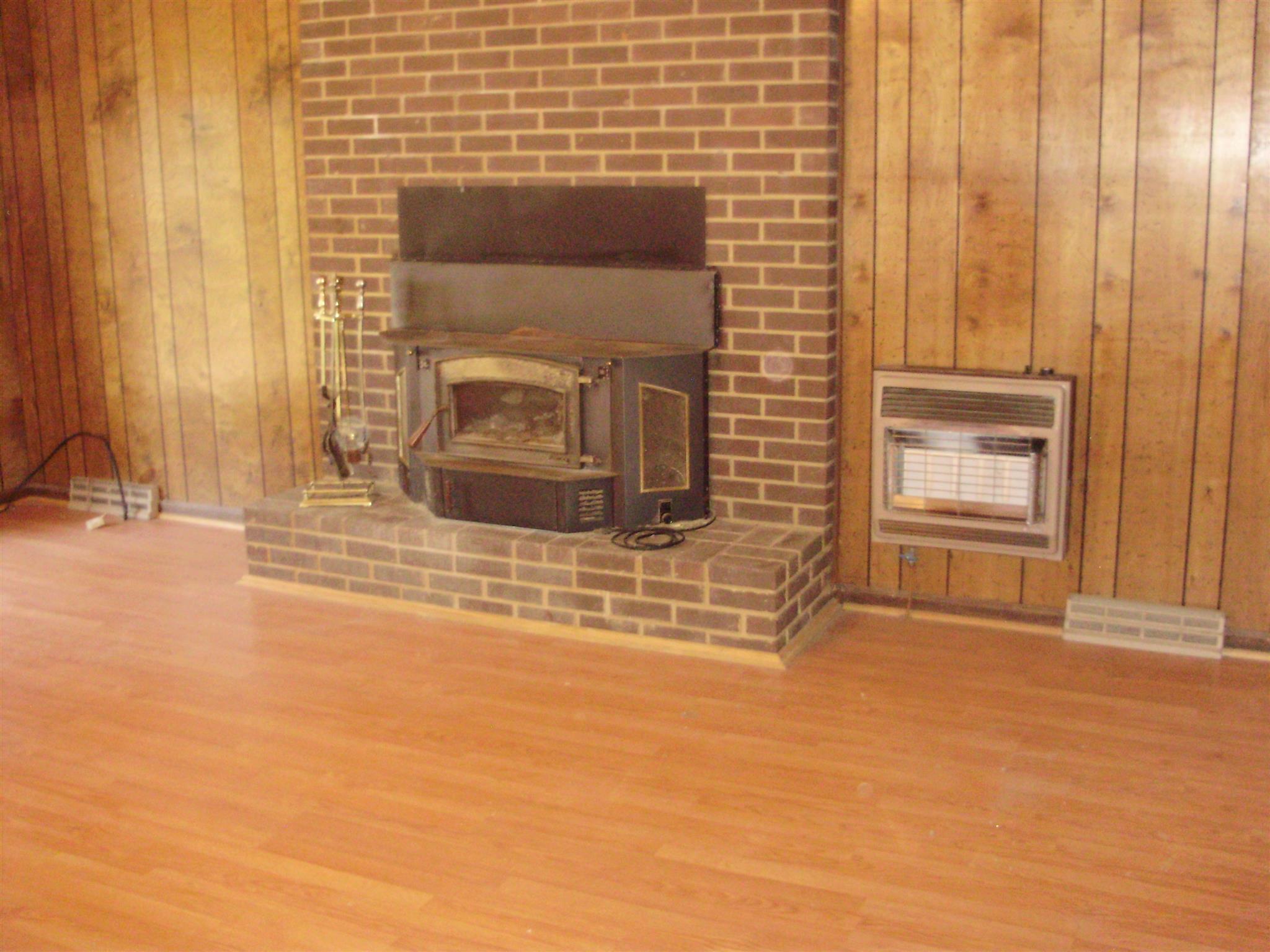 51 Ramah Road Leoma, TN 38468 - Photo 18 of 30 a view of empty room with wooden floor and fireplace