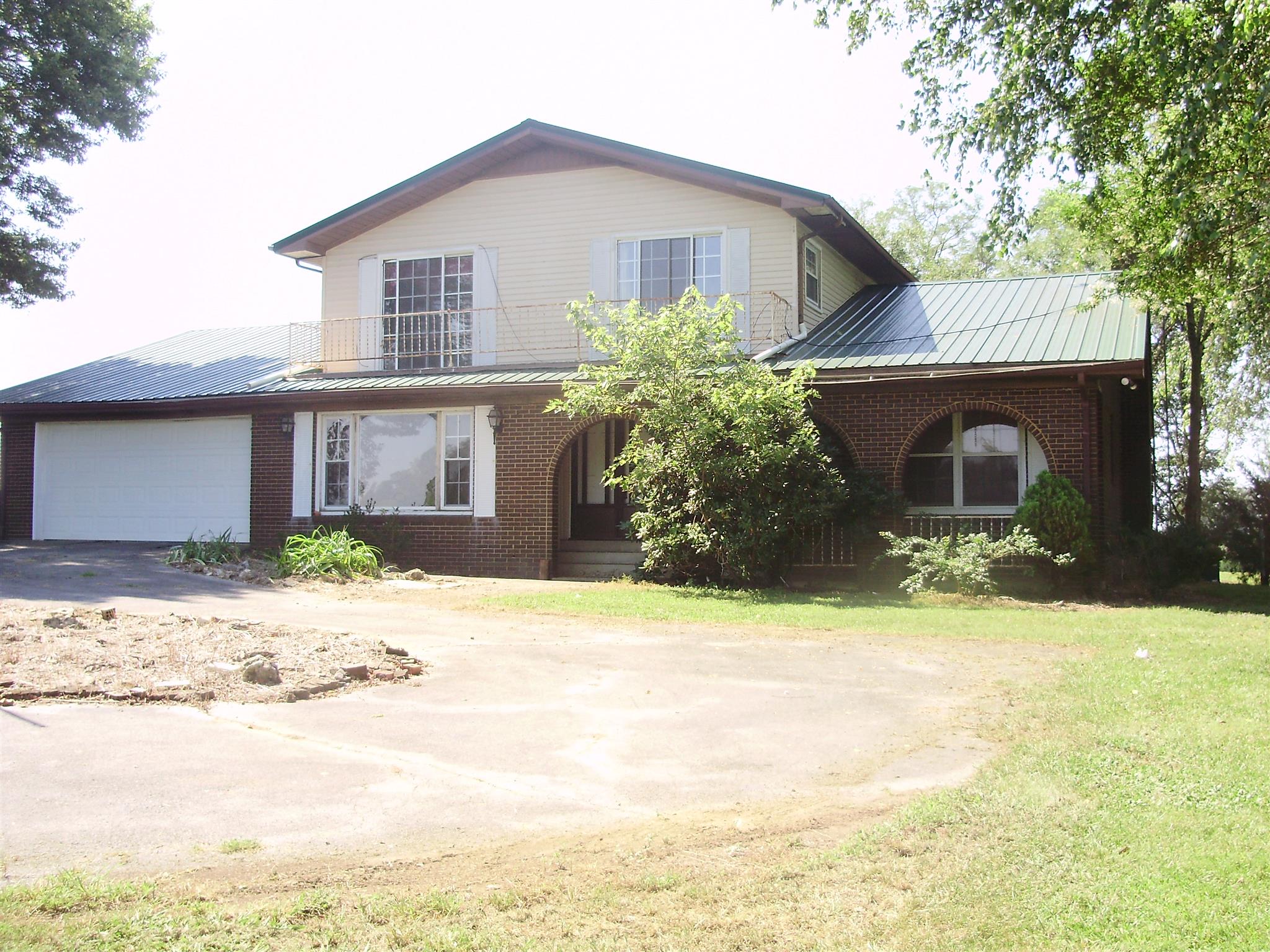 51 Ramah Road Leoma, TN 38468 - Photo 28 of 30 a front view of a house with a yard and garage