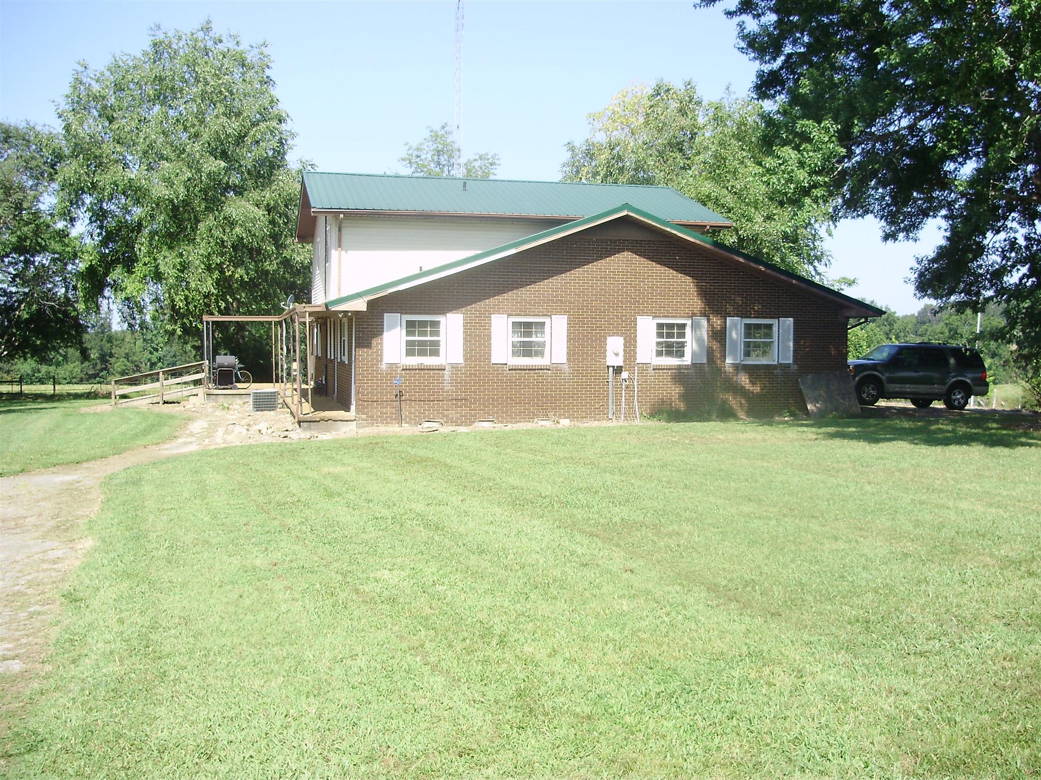 51 Ramah Road Leoma, TN 38468 - Photo 9 of 30 a front view of a house with a garden and trees