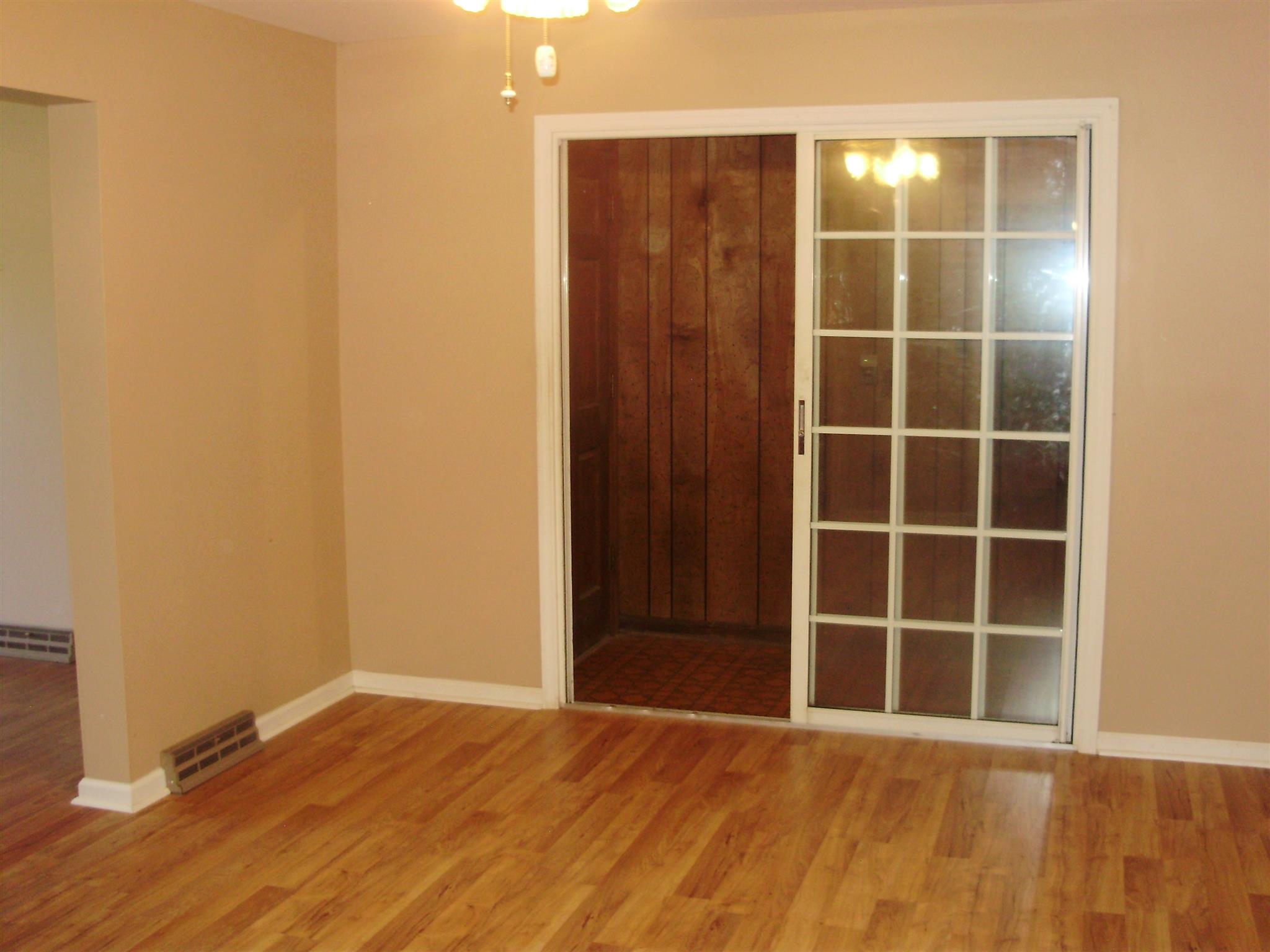 51 Ramah Road Leoma, TN 38468 - Photo 10 of 30 a view of empty room with wooden floor and windows