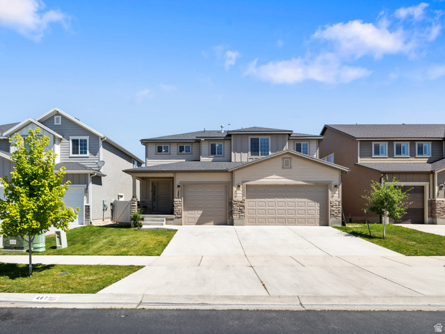 467 East Rue De Paris Vineyard, UT 84059 - Photo 1 of 36 Two-story residence featuring a two-car garage, stone accents, and a covered entry