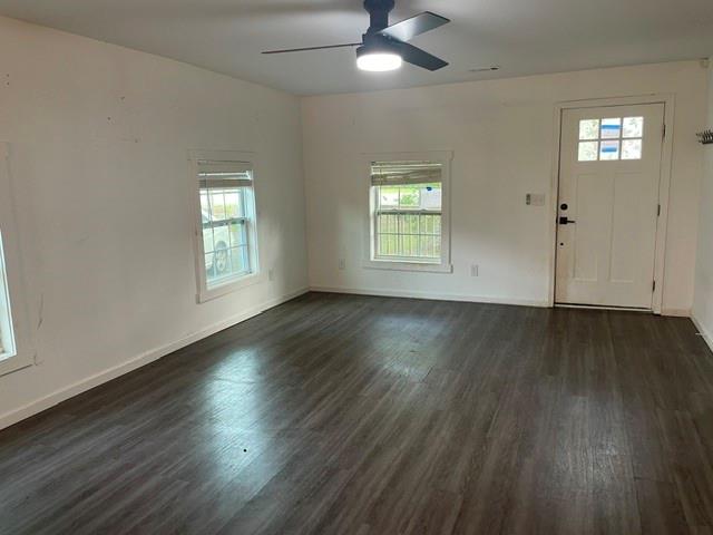 4495 Calhoun Road Northeast Rome, GA 30161 - Photo 5 of 14 a view of an empty room with wooden floor and a window