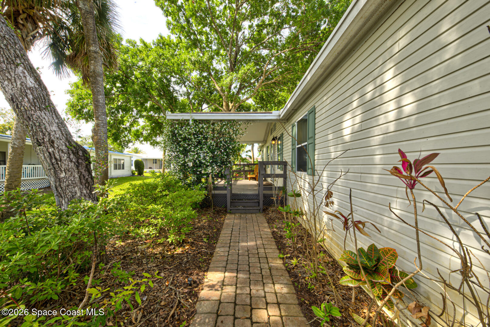 176 Woodsmill Boulevard, Unit 177 Cocoa, FL 32926 - Photo 7 of 63 5 walkway to front door