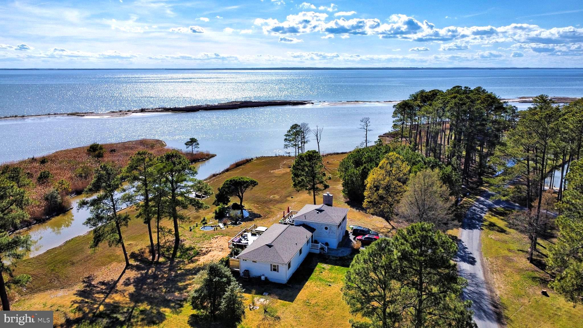 3310 Belfiore Road Church Creek, MD 21622 - Photo 1 of 55 a view of a lake with a mountain in the background