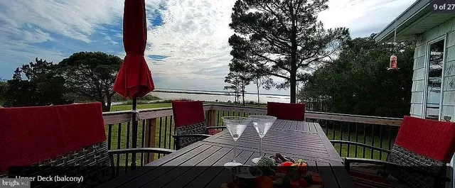 a kitchen with granite countertop wooden cabinets and stainless steel appliances