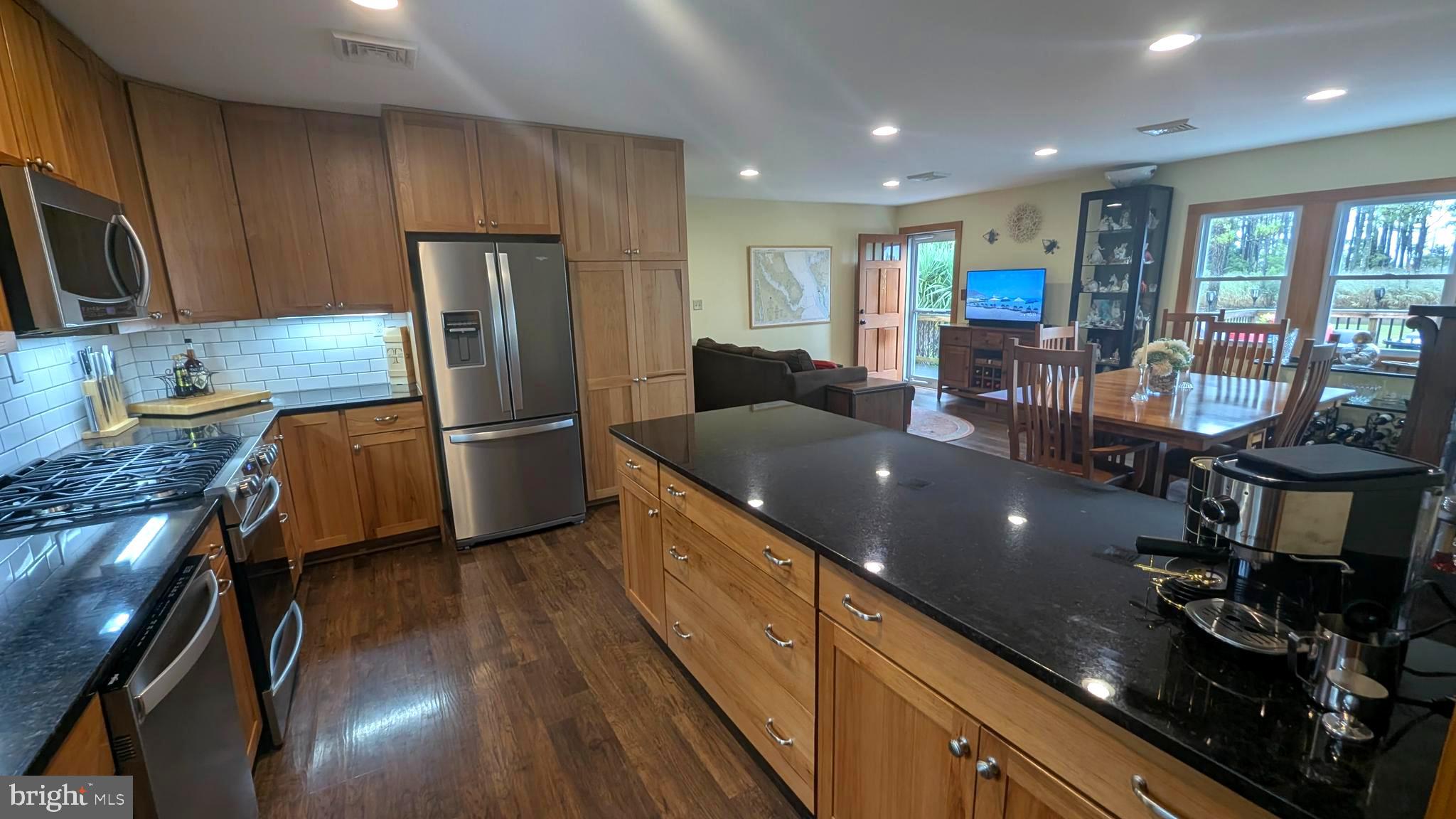3310 Belfiore Road Church Creek, MD 21622 - Photo 20 of 55 a kitchen with stainless steel appliances granite countertop a sink stove and refrigerator