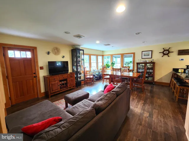 a living room with furniture fireplace and flat screen tv