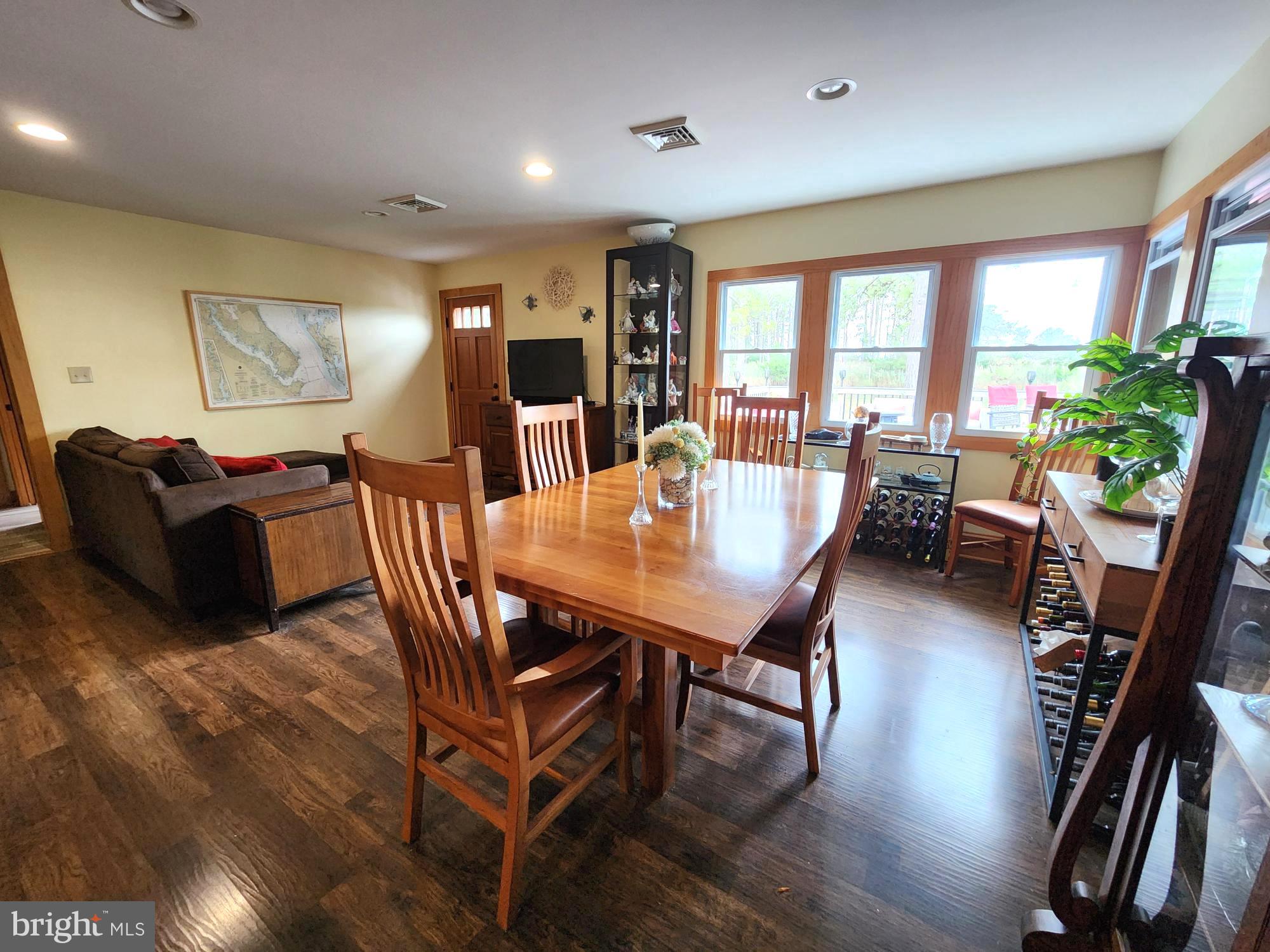 3310 Belfiore Road Church Creek, MD 21622 - Photo 24 of 55 a view of a dining room with furniture window and wooden floor