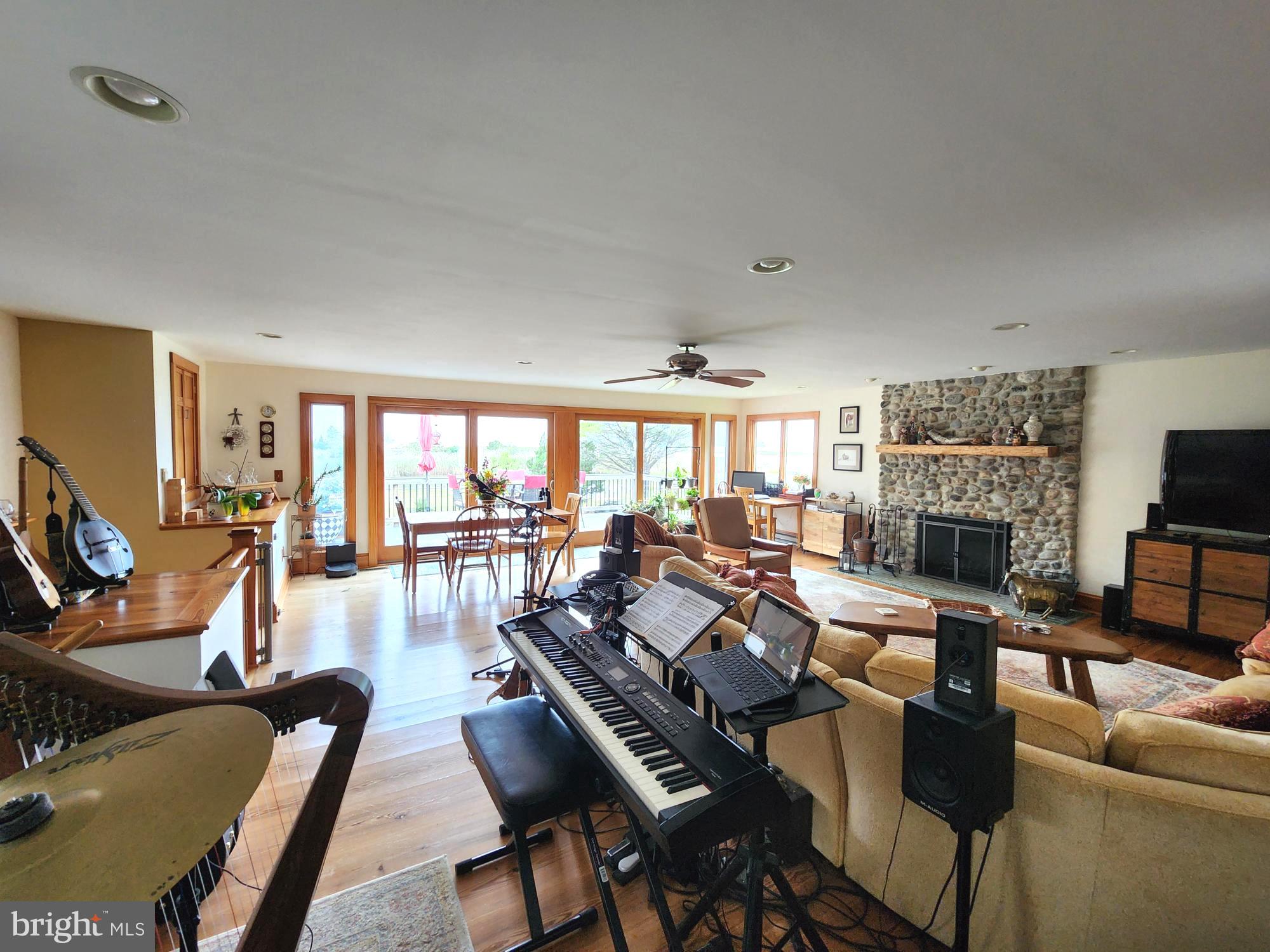 3310 Belfiore Road Church Creek, MD 21622 - Photo 29 of 55 a living room with furniture and a fireplace