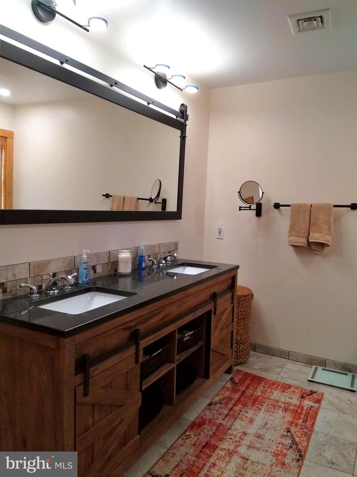 3310 Belfiore Road Church Creek, MD 21622 - Photo 34 of 55 a bathroom with a sink and a mirror