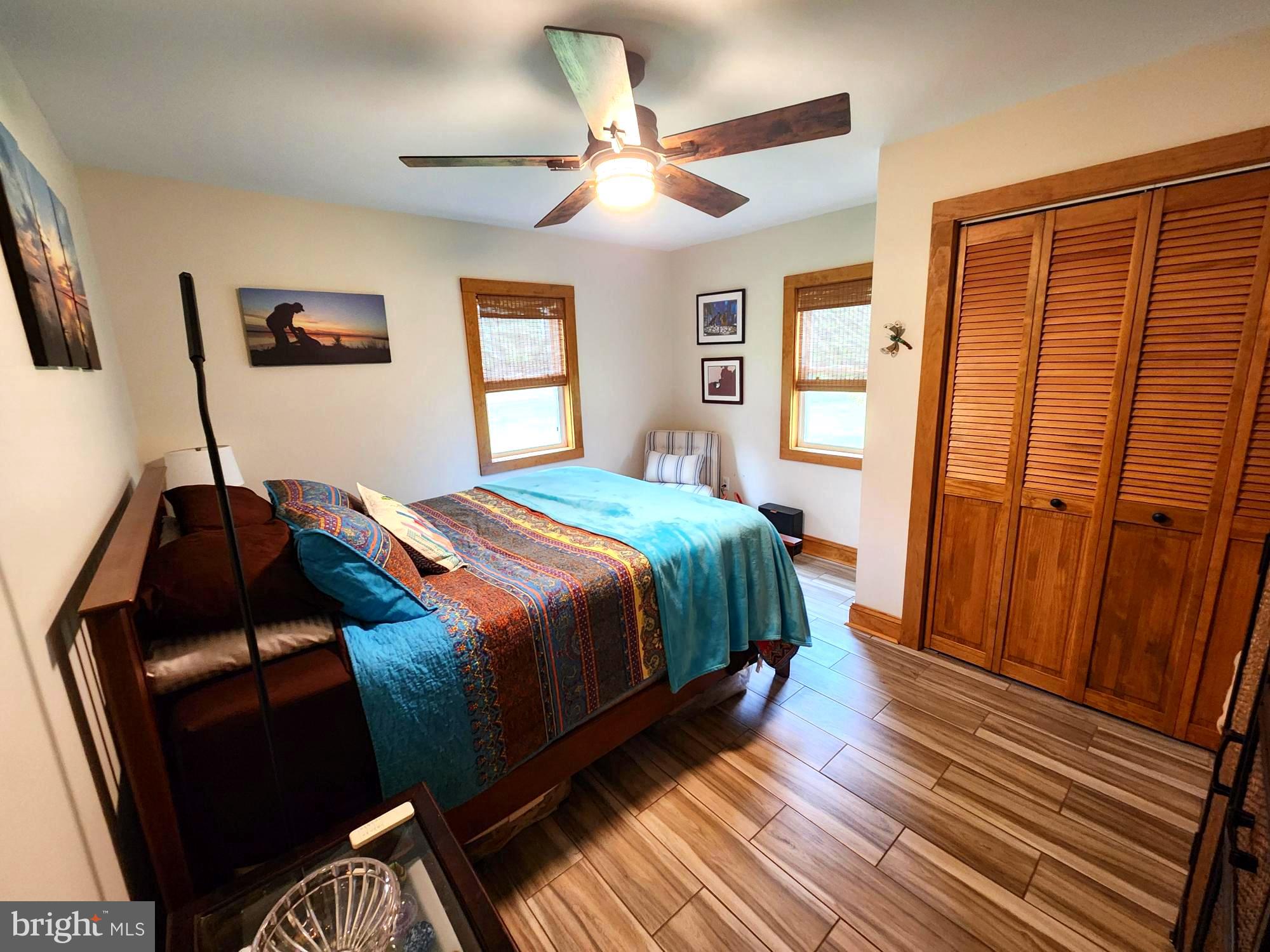 3310 Belfiore Road Church Creek, MD 21622 - Photo 37 of 55 a bedroom with a bed and wooden floor