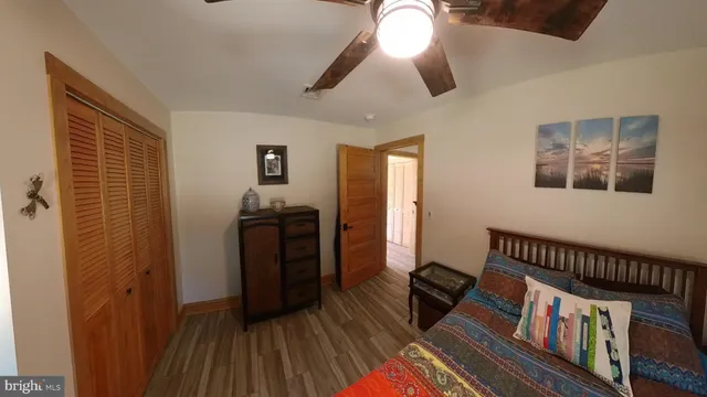 a view of a hallway with wooden walls and stairs