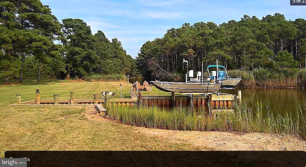 3310 Belfiore Road Church Creek, MD 21622 - Photo 42 of 55 a view of a lake with a house