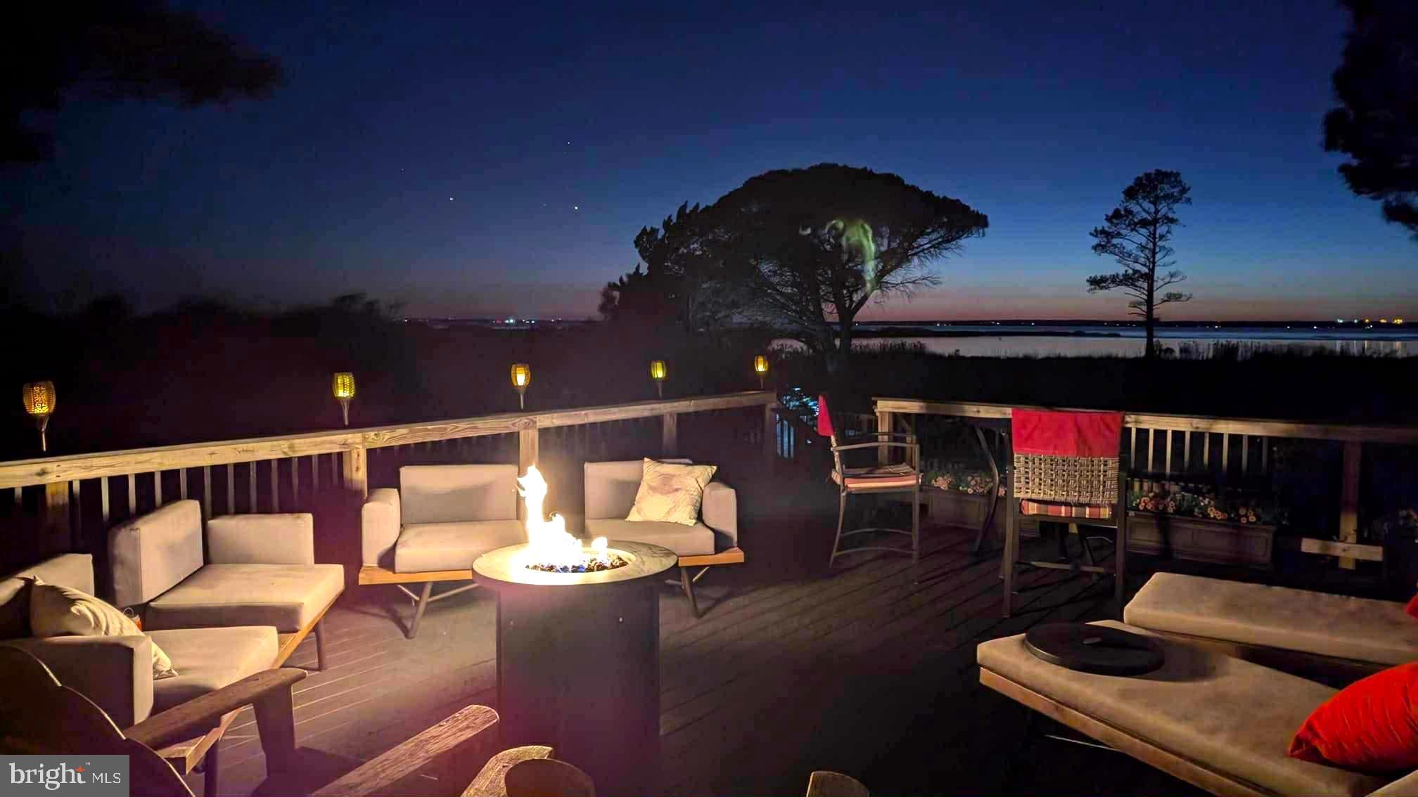 3310 Belfiore Road Church Creek, MD 21622 - Photo 46 of 55 a roof deck with table and chairs with wooden floor