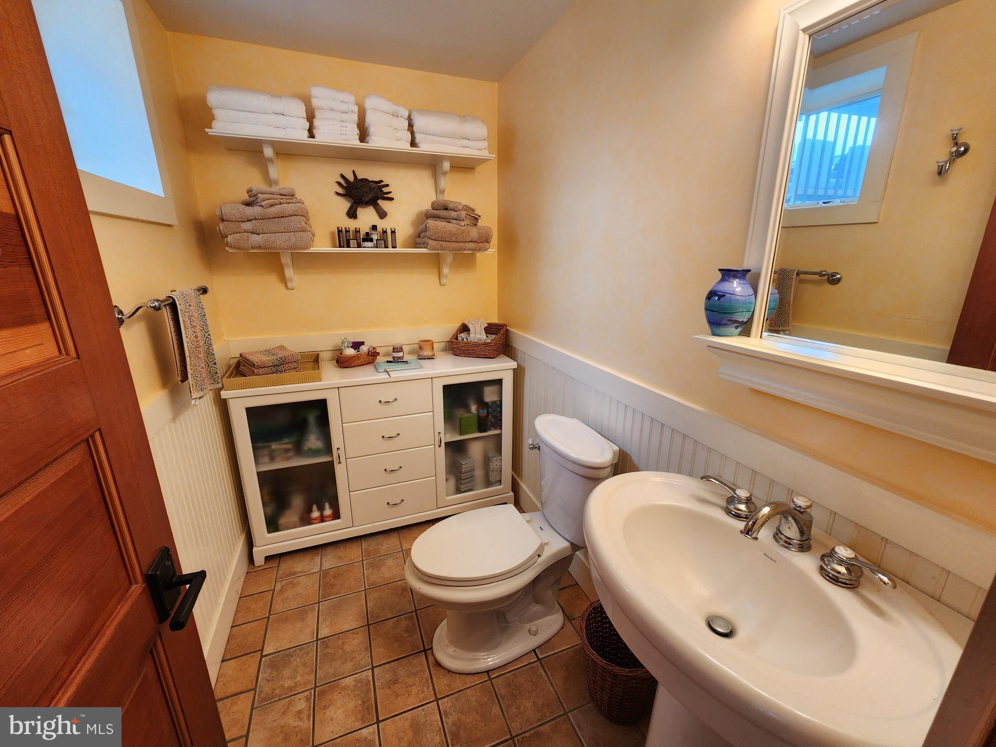 3310 Belfiore Road Church Creek, MD 21622 - Photo 47 of 55 a bathroom with a sink a toilet and a mirror