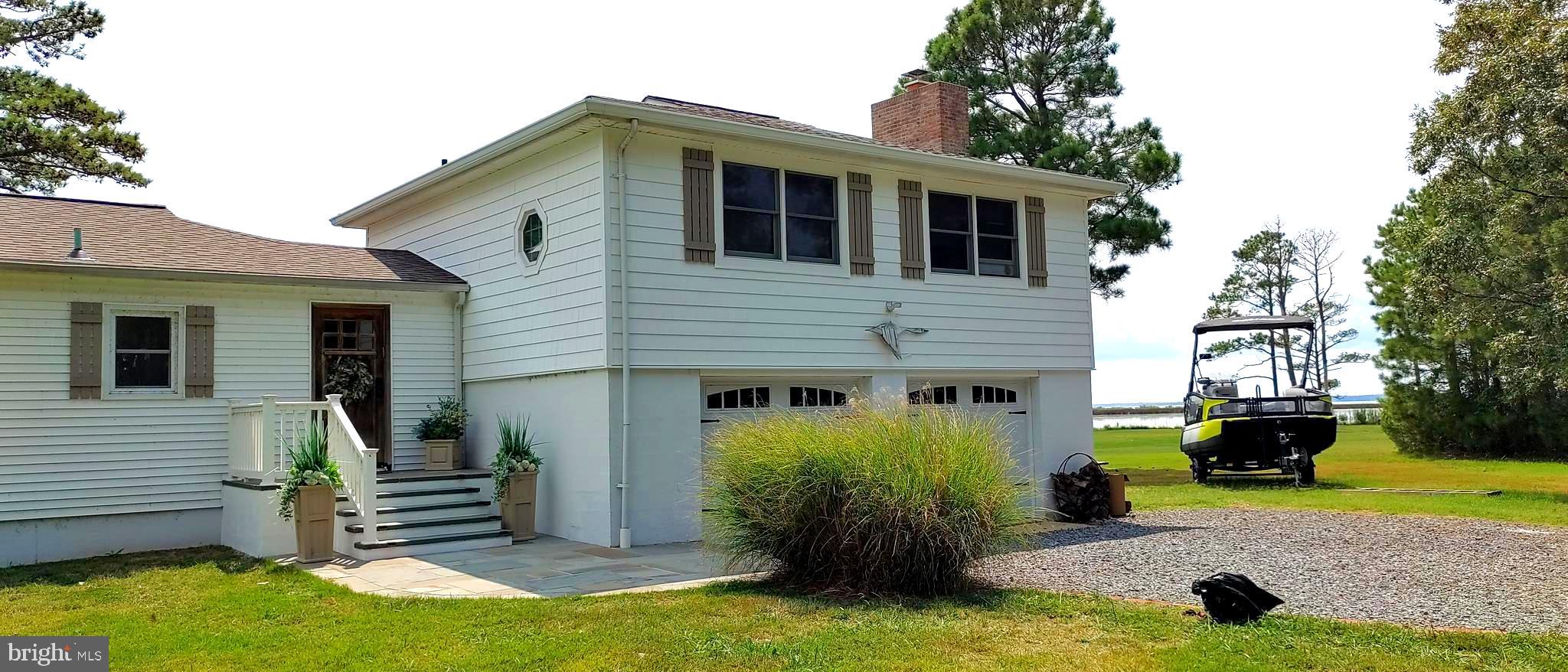 3310 Belfiore Road Church Creek, MD 21622 - Photo 50 of 55 a front view of a house with garden