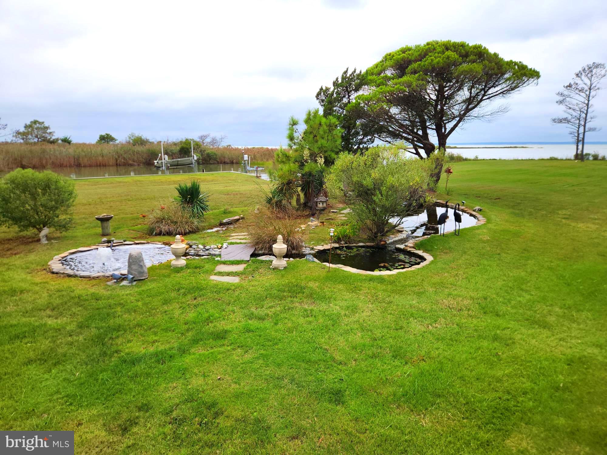 3310 Belfiore Road Church Creek, MD 21622 - Photo 51 of 55 a view of a lake with houses in the background