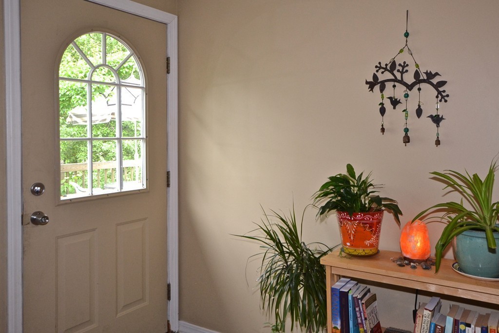 16 Harvard Street Fairhaven, MA 02719 - Photo 12 of 14 a view of a entryway with a flower pot and a window