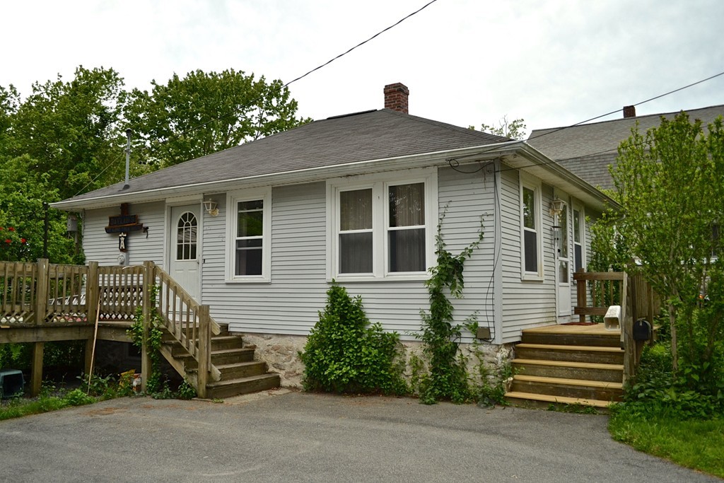 16 Harvard Street Fairhaven, MA 02719 - Photo 2 of 14 a front view of a house with a yard
