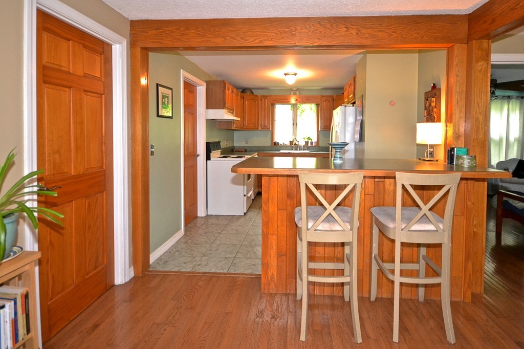 16 Harvard Street Fairhaven, MA 02719 - Photo 7 of 14 a view of a kitchen with furniture and wooden floor