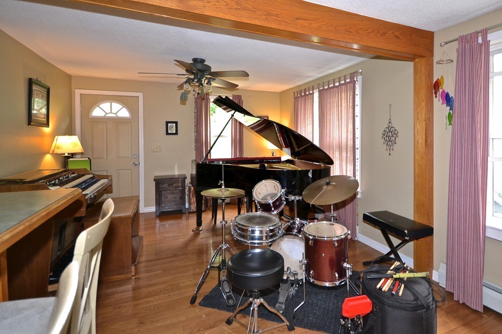 16 Harvard Street Fairhaven, MA 02719 - Photo 8 of 14 a living room with furniture and wooden floor