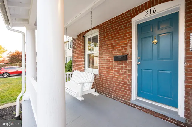 a view of a door and chair in the balcony