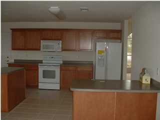 247 East Shipwreck Road Santa Rosa Beach, FL 32459 - Photo 1 of 1 a kitchen with granite countertop a stove and a sink