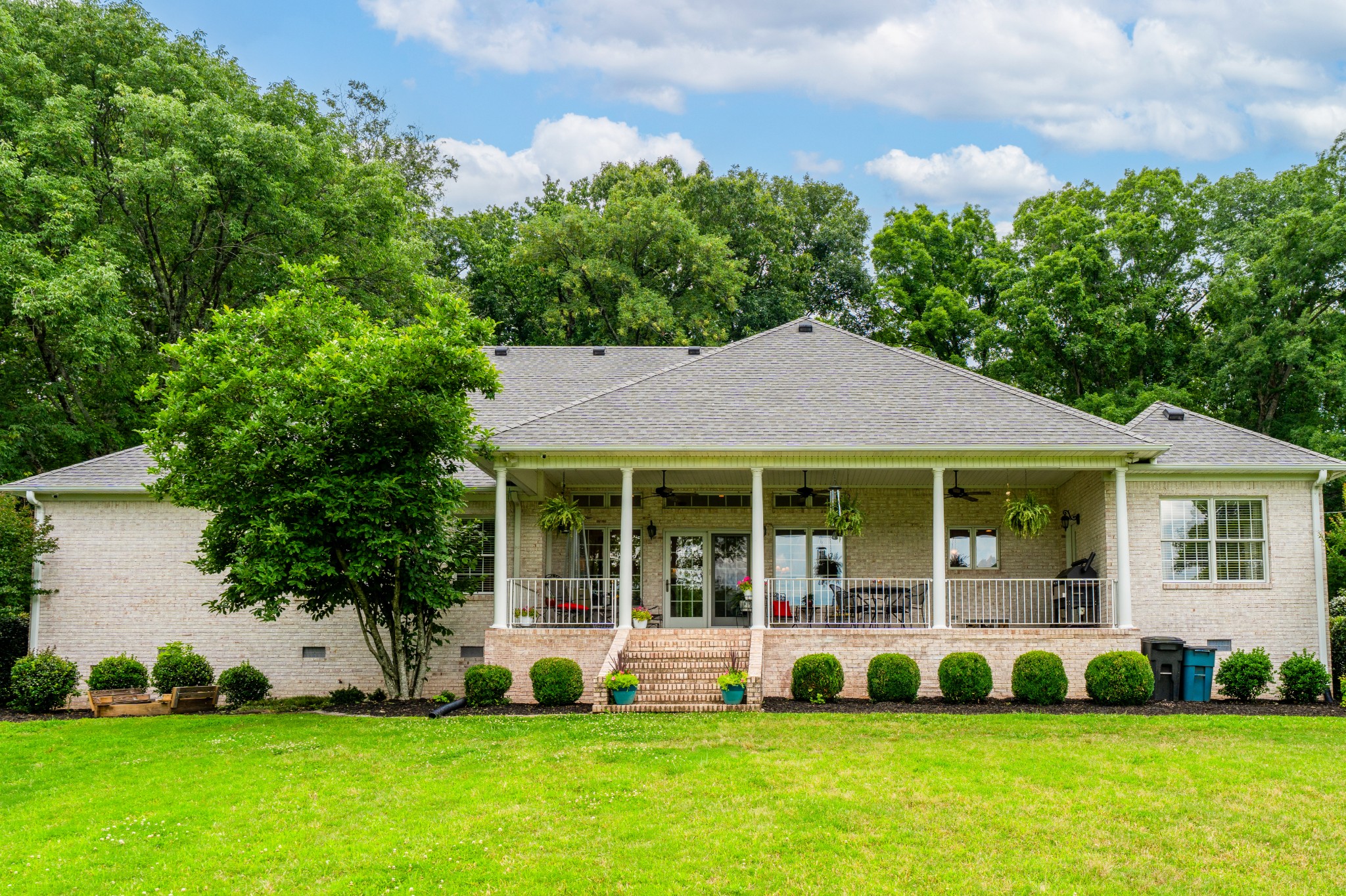 1015 Kelly Road Dyersburg, TN 38024 - Photo 6 of 41 a front view of a house with a yard and green space
