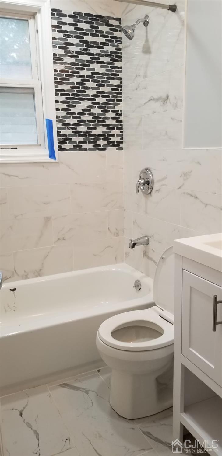 195 County Road Cliffwood, NJ 07721 - Photo 14 of 28 a white toilet sitting next to a bath tub