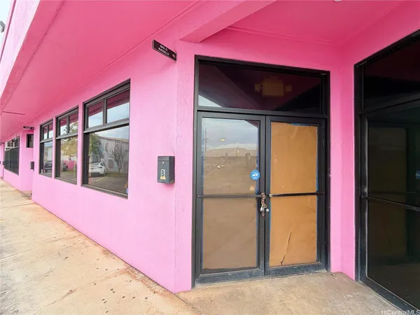 a view of a house with a door and a window