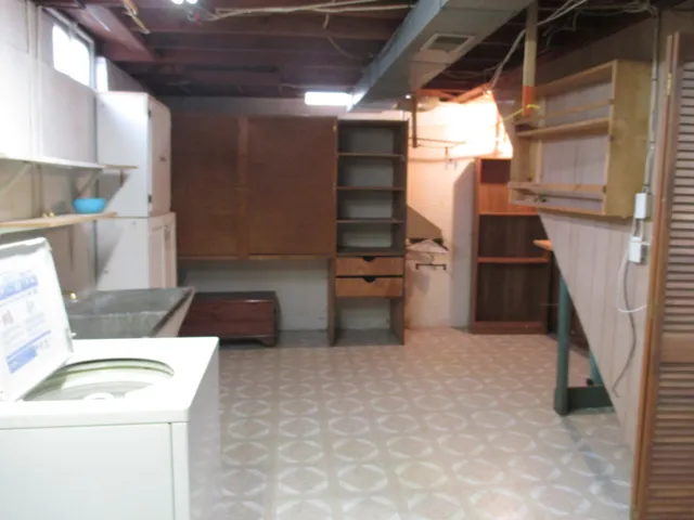 a storage room with washer and dryer