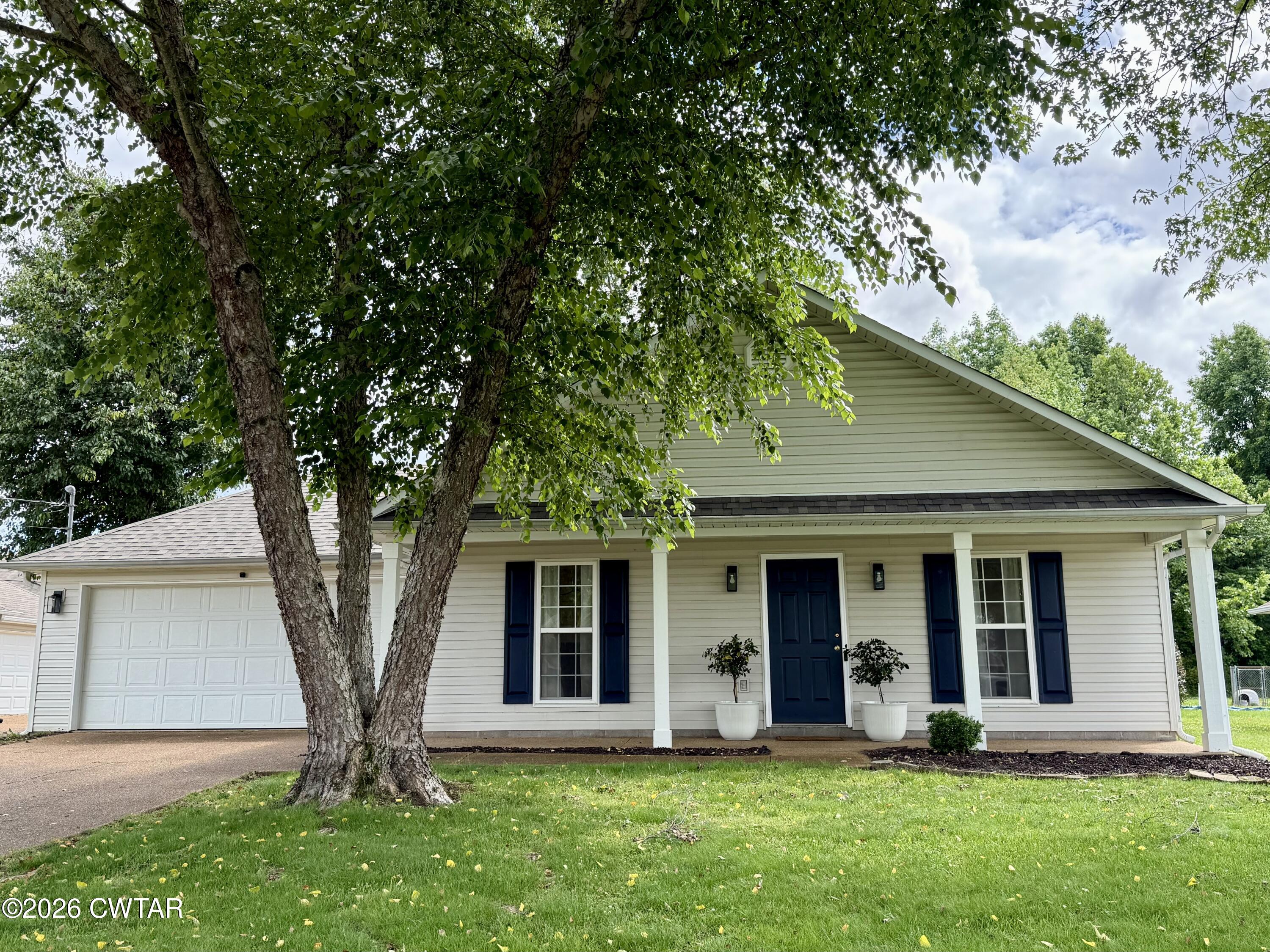 80 Rooker Drive Jackson, TN 38305 - Photo 29 of 30 front view of a house with a yard