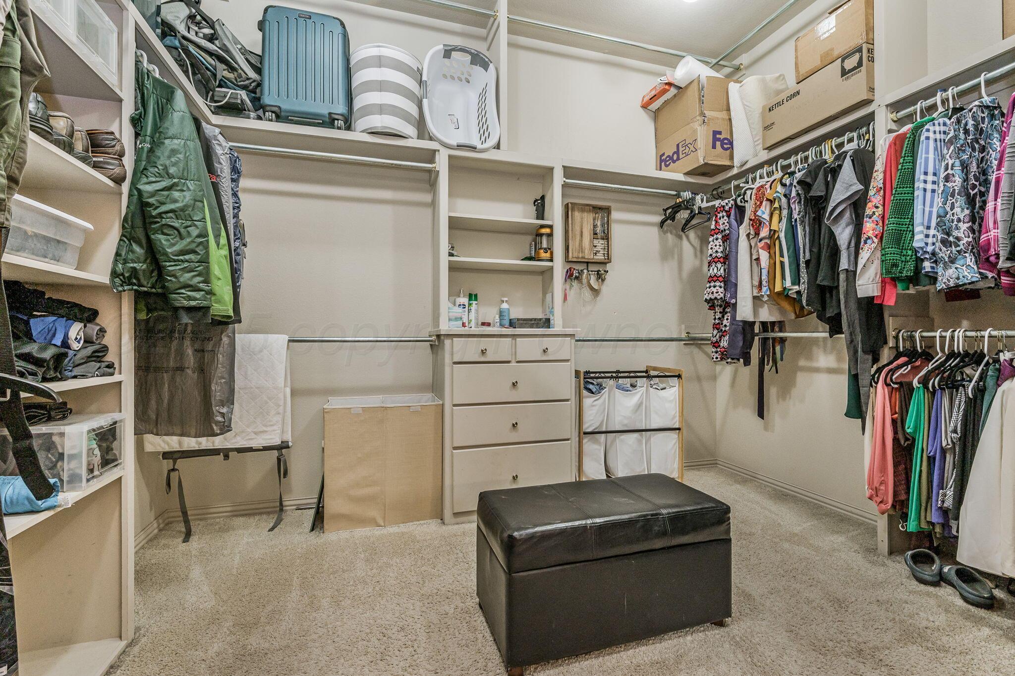 7 Pebble Beach Court Amarillo, TX 79124 - Photo 29 of 67 a view of walk in closet with clothes and shoes