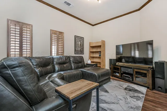 a kitchen with stainless steel appliances granite countertop a stove and a refrigerator
