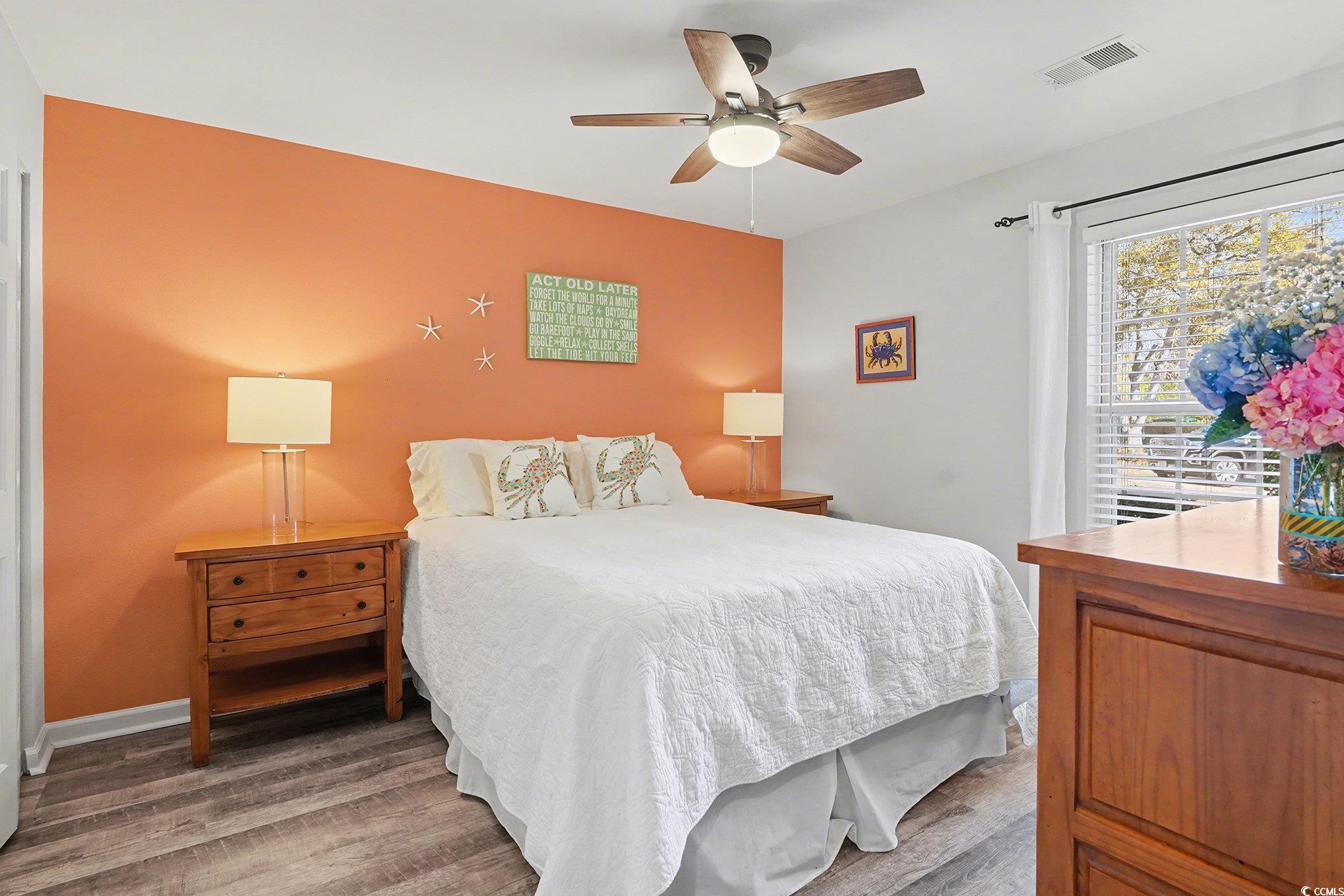 725 Blue Stem Drive, Unit 66B Pawleys Island, SC 29585 - Photo 21 of 30 Bedroom with wood finished floors and a ceiling fan