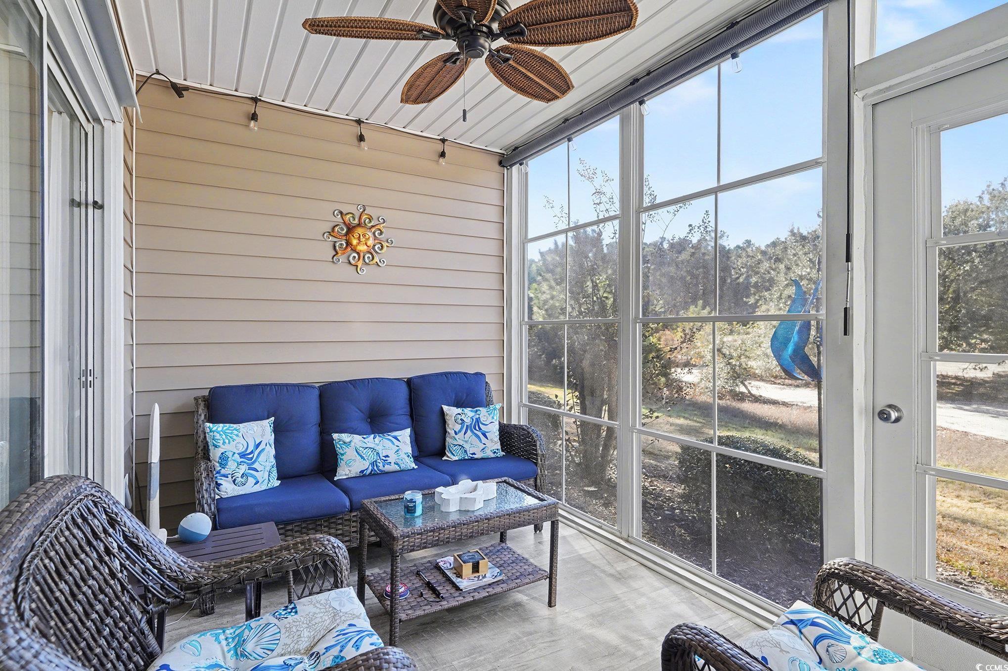 725 Blue Stem Drive, Unit 66B Pawleys Island, SC 29585 - Photo 23 of 30 Sunroom featuring outdoor lounge area and a ceiling fan