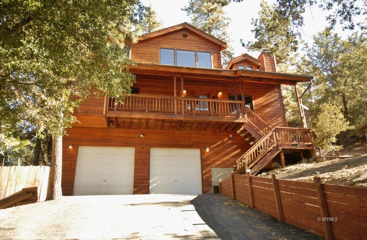 26720 Saunders Meadow Road Idyllwild, CA 92549 - Photo 2 of 65 a view of a house with a iron gate