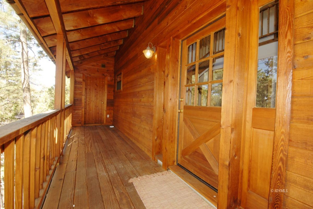 26720 Saunders Meadow Road Idyllwild, CA 92549 - Photo 4 of 65 a view of a balcony with wooden floor