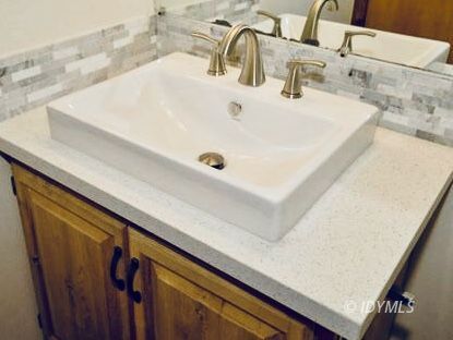 26720 Saunders Meadow Road Idyllwild, CA 92549 - Photo 58 of 65 a bathroom with a sink and a mirror