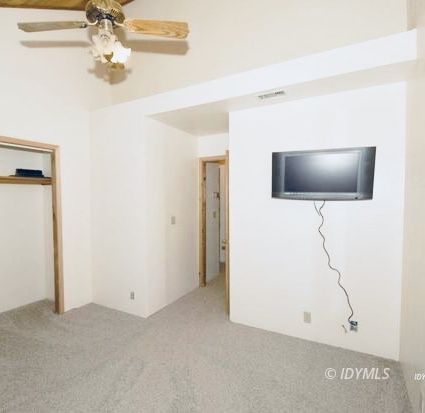 26720 Saunders Meadow Road Idyllwild, CA 92549 - Photo 61 of 65 a view of a livingroom with a ceiling fan and a chandelier fan