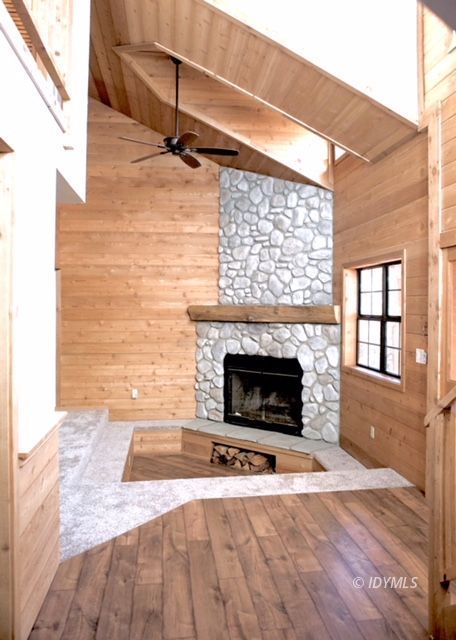 26720 Saunders Meadow Road Idyllwild, CA 92549 - Photo 8 of 65 a view of a livingroom with a fireplace and window