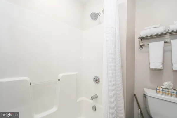 a bathroom with a bathtub and shower