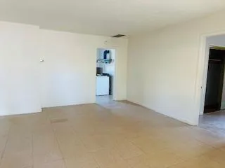 a bathroom with a sink mirror and shower