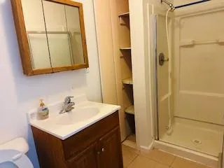a white toilet sitting next to a bathroom sink