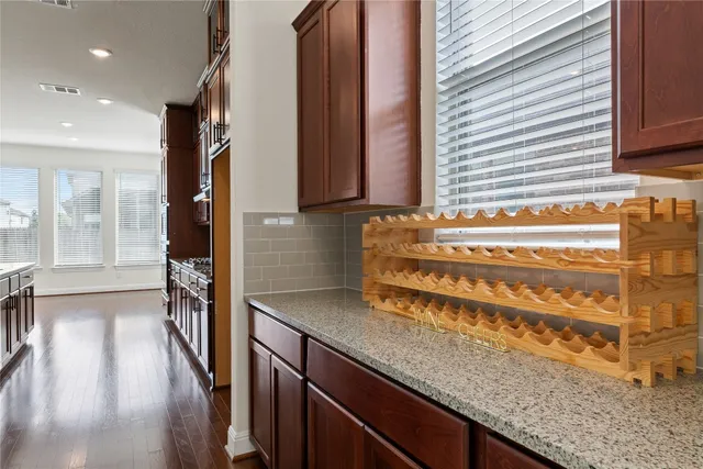 a view of a kitchen with a sink and cabinets